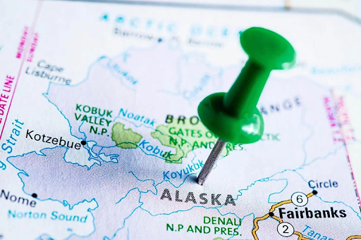 Map of Alaska with a green pushpin marking the state, representing BSN nursing programs in Alaska.